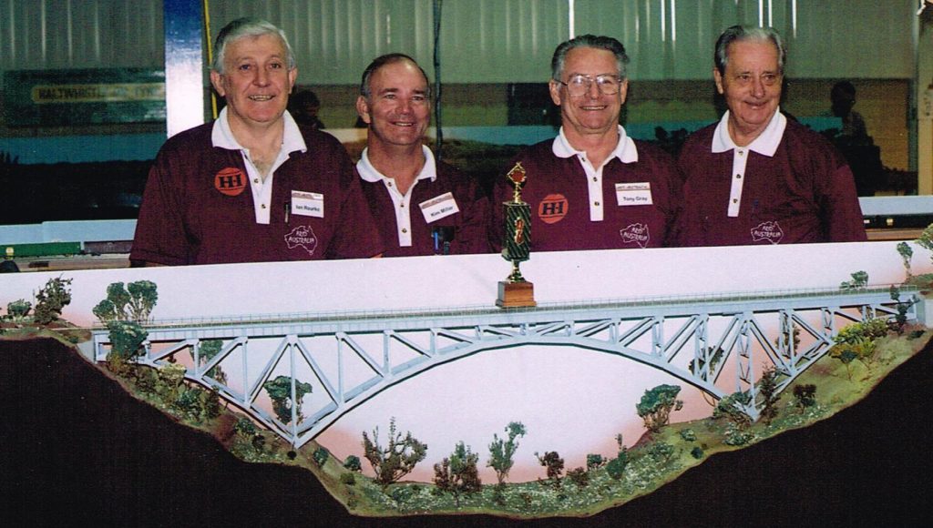 Ian Rourke (left) with Kim Miller, Tony Gray and Len Hughes, part of the Arid Australia group and the AMRA trophy awarded to the best layout at the exhibition on Monday June 03 1996, the morning after the second World record train had been run. A very proud moment for Ian and the team involved with the Arid Australia "project".